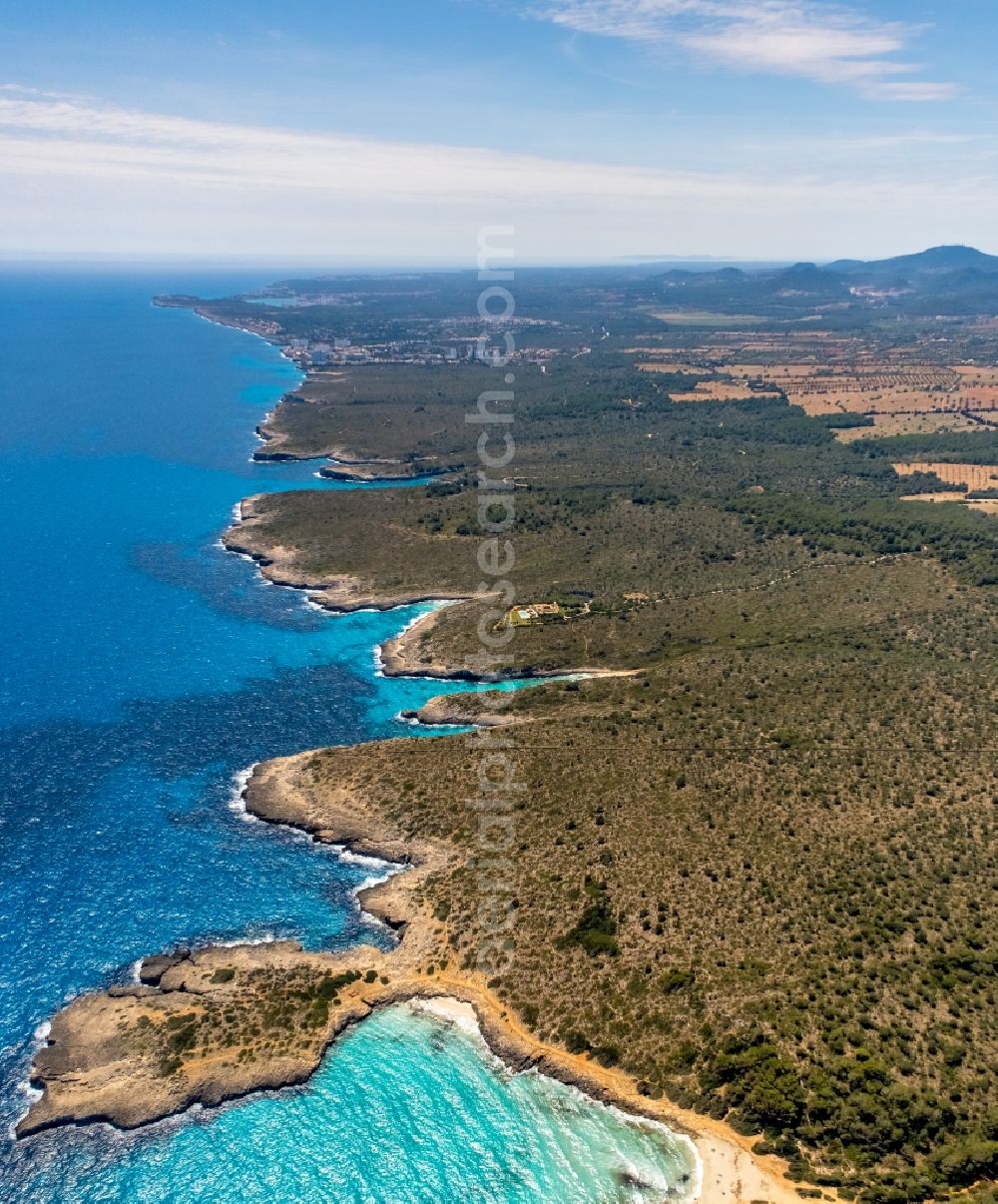 Aerial image Manacor - Water surface at the seaside with rock formations in Manacor in Balearic islands, Spain