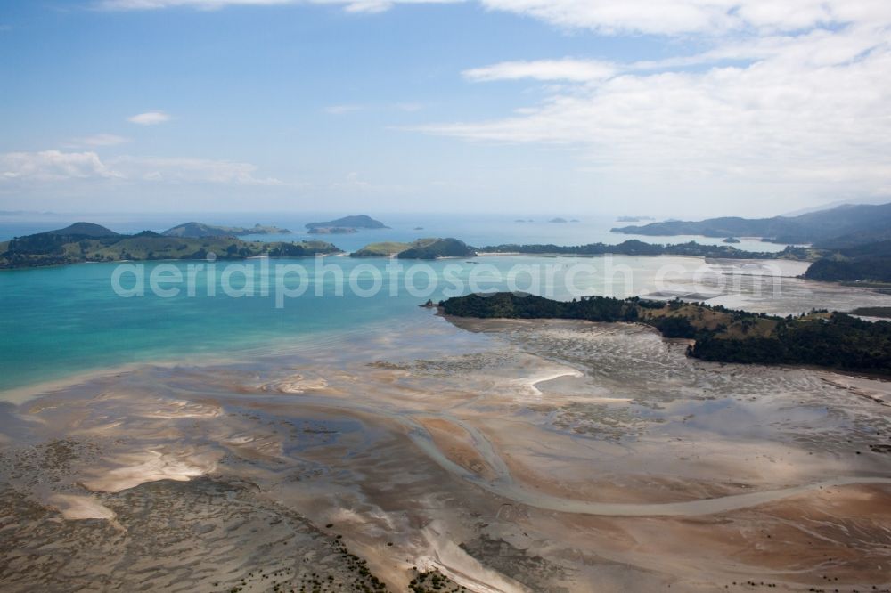 Wyuna Bay from the bird's eye view: Water surface at the seaside McGregor Bay in the district Coromandel in Wyuna Bay in Waikato, New Zealand