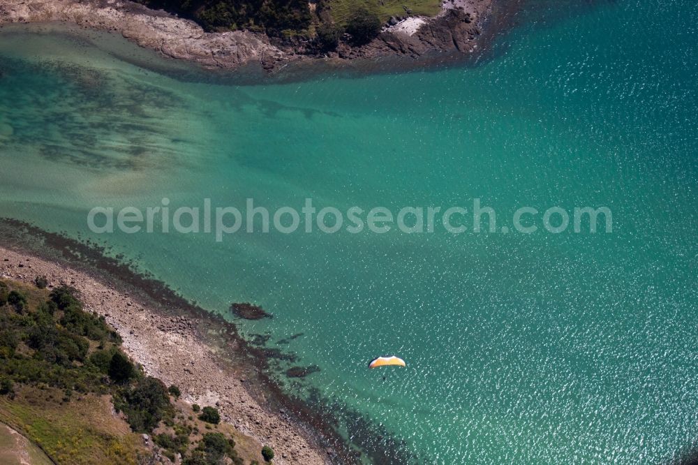 Aerial image Wyuna Bay - Water surface at the seaside McGregor Bay in the district Coromandel in Wyuna Bay in Waikato, New Zealand