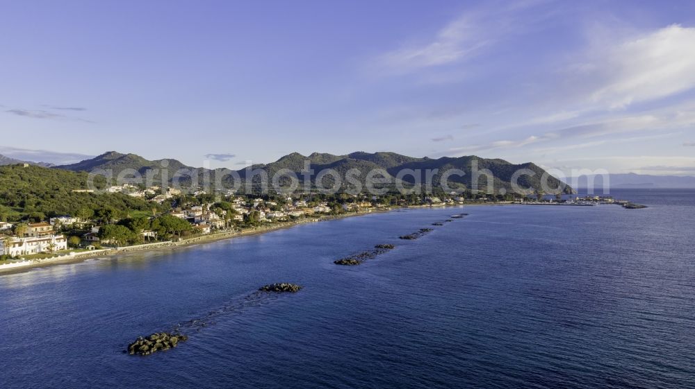 Aerial image Perd'e Sali - Water surface at the seaside of the Tyrrhenian Sea in the Mediterranean Sea in Perd'e Sali in Sardegna - Sardinia, Italy