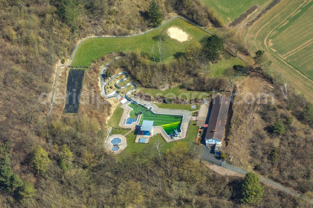 Aerial image Volkmarsen - Waterslide on Swimming pool of the Burgschwimmbad on Kugelsburg in Volkmarsen in the state Hesse, Germany