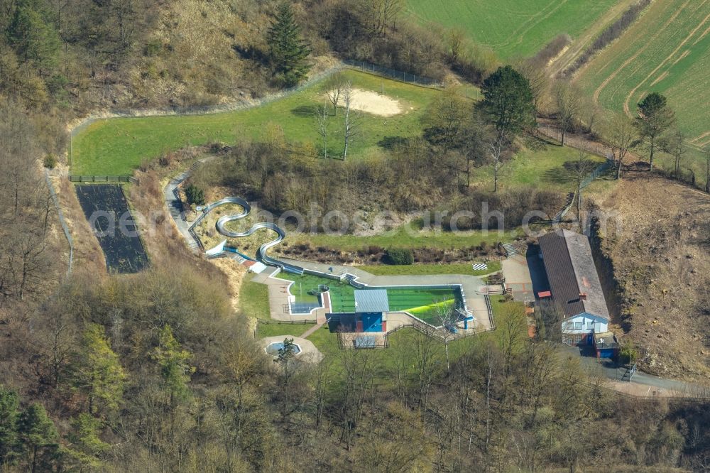 Volkmarsen from above - Waterslide on Swimming pool of the Burgschwimmbad on Kugelsburg in Volkmarsen in the state Hesse, Germany