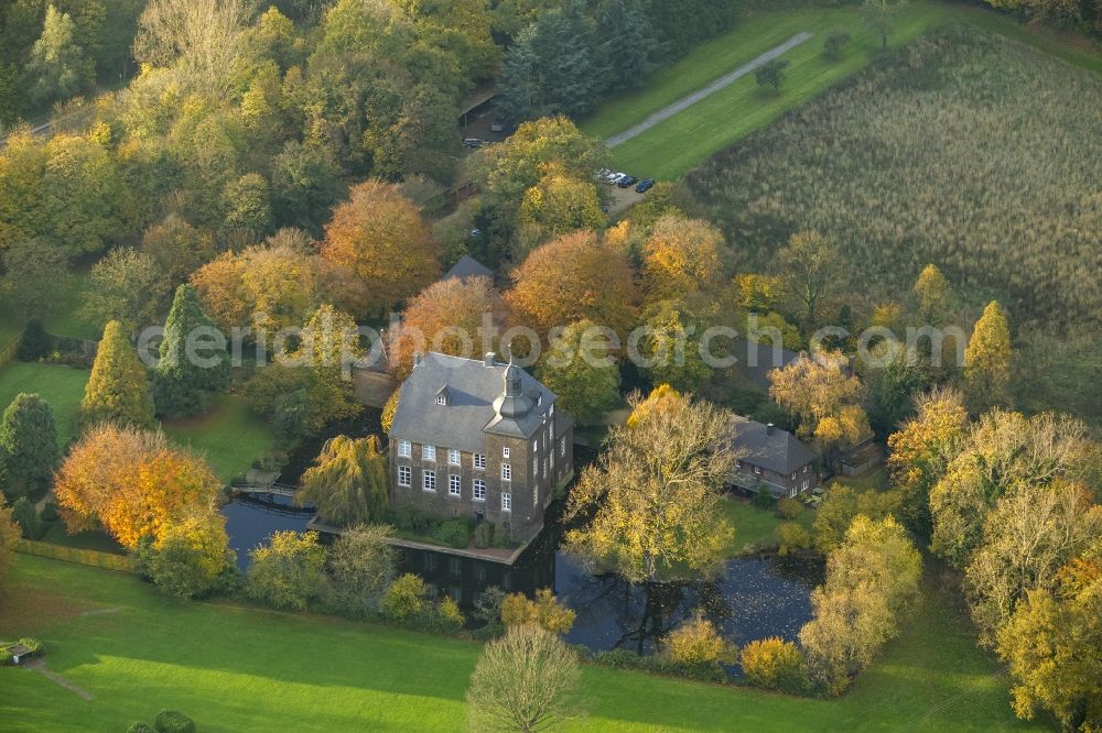 Voerde from above - View of the historic moated castle House Voerde embedded in an autumnal landscape garden at Allee 65 in the state North Rhine-Westphalia