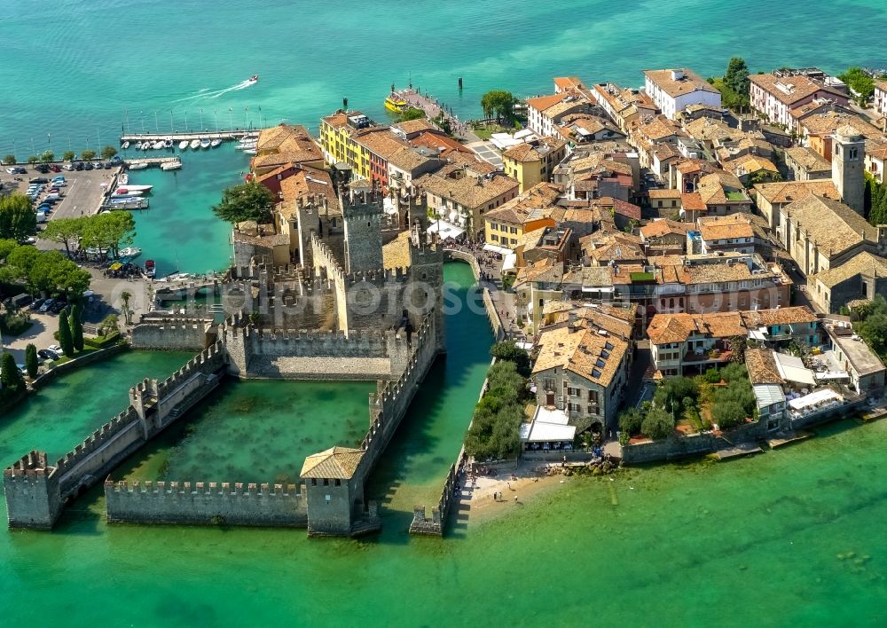 Sirmione from the bird's eye view: Building of water castle Scaligerburg - Castello Scaligero on the headland Sirmione in Lombardia, Italy