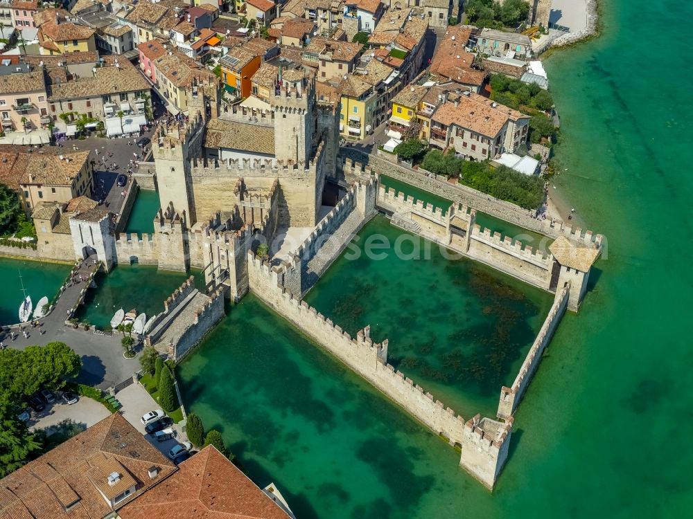 Sirmione from above - Building of water castle Scaligerburg - Castello Scaligero on the headland Sirmione in Lombardia, Italy