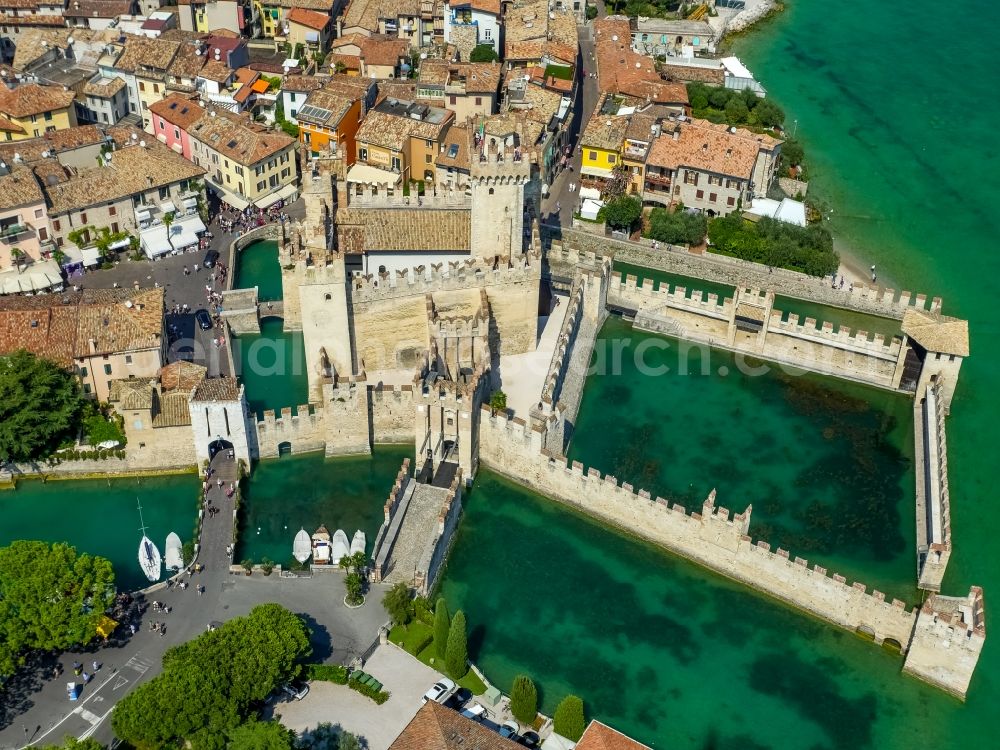 Sirmione from the bird's eye view: Building of water castle Scaligerburg - Castello Scaligero on the headland Sirmione in Lombardia, Italy