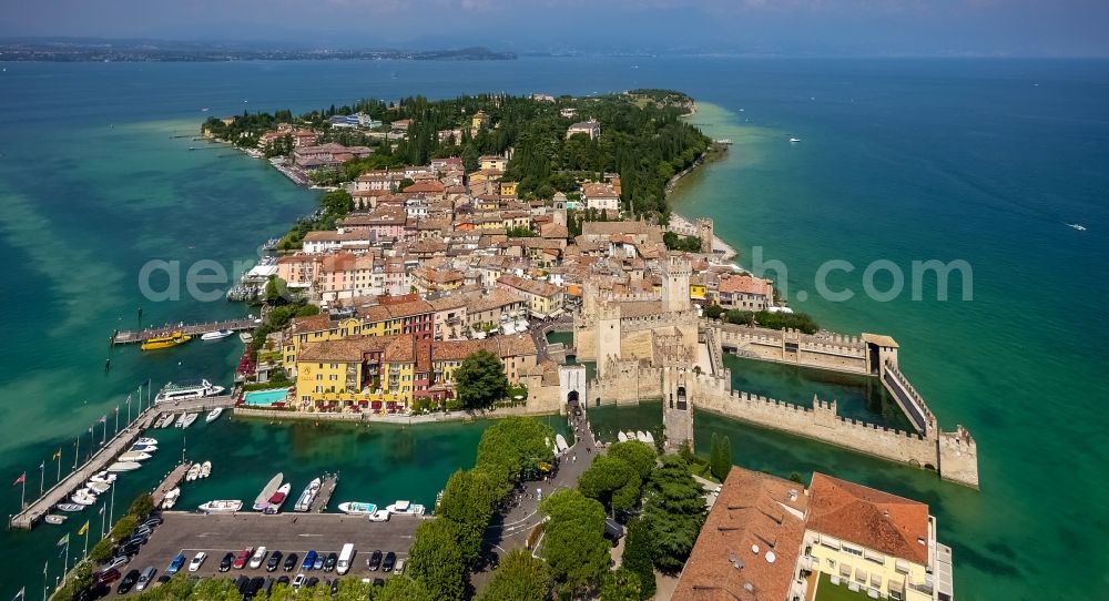 Aerial image Sirmione - Building of water castle Scaligerburg - Castello Scaligero on the headland Sirmione in Lombardia, Italy