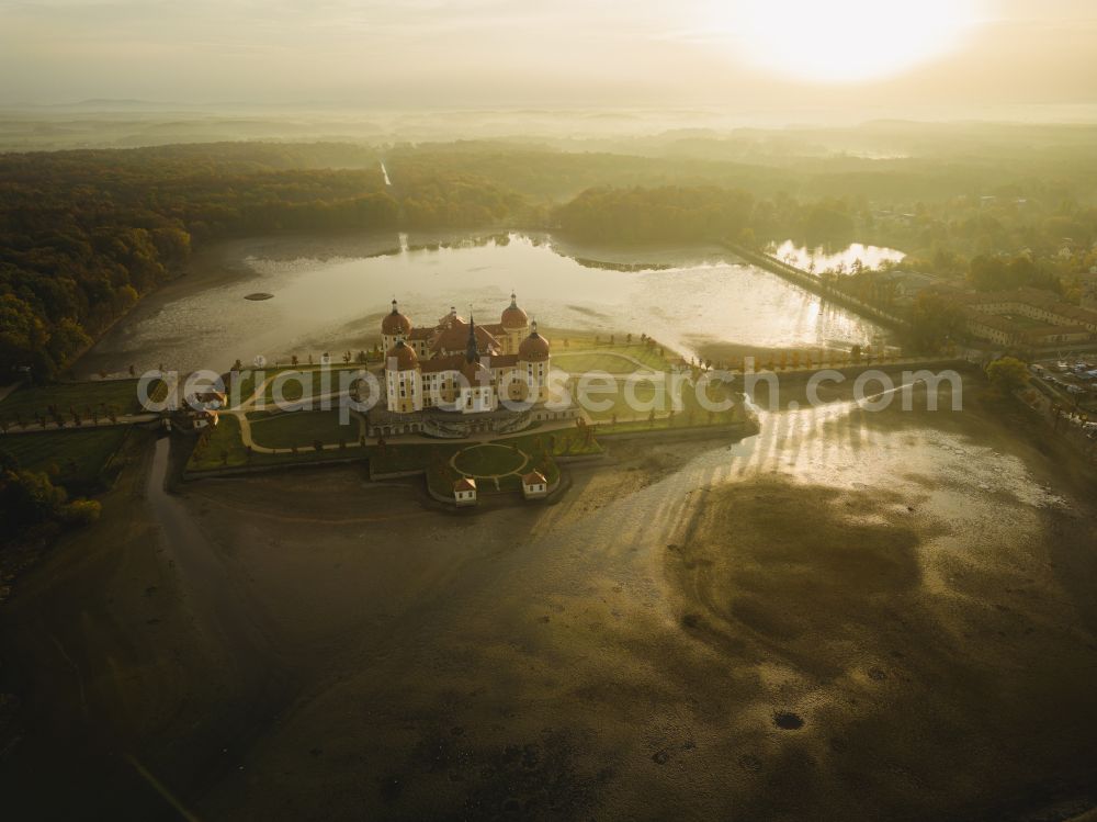 Moritzburg from above - Sunrise over the hunting and moated castle and castle park in the castle pond in Moritzburg in the federal state of Saxony, Germany