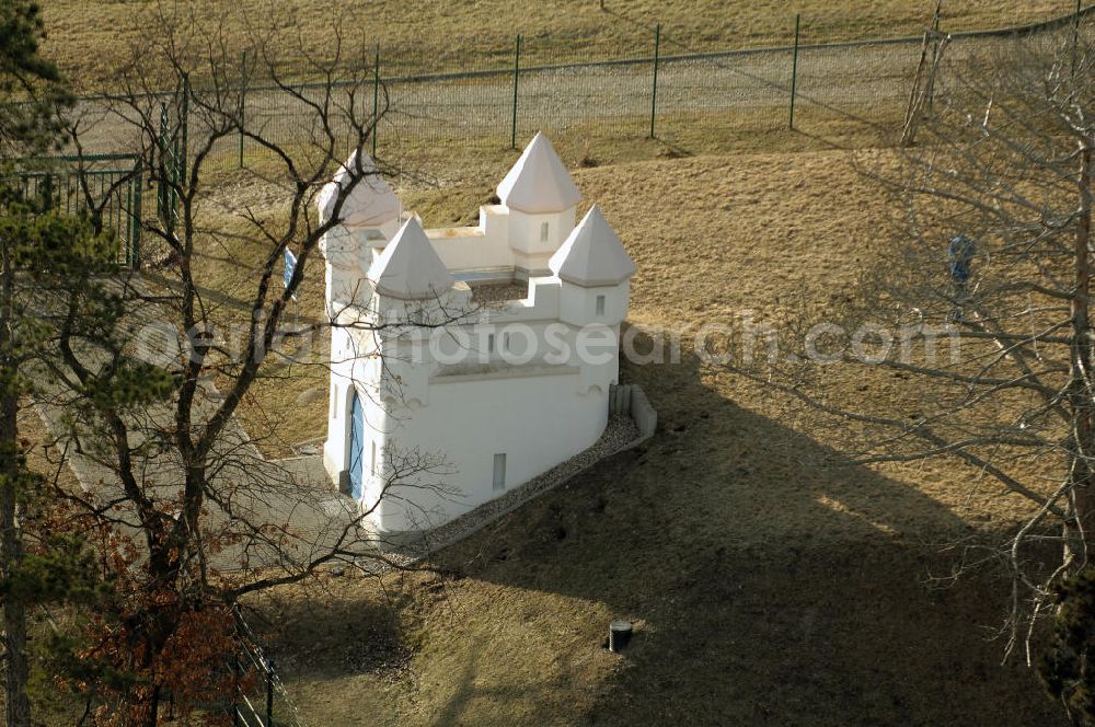 OTTENHAUSEN from the bird's eye view: Blick auf das Wasserschlösschen . Es handelt sich um ein mehrtürmiges Miniaturschloss von 1904, das neben einem Hochbehälter innerhalb einer Baumgruppe errichtet wurde. Dieser Wasserspeicher versorgt das Städtchen mit Ohra-Talsperrenwasser. Ottenhausen ist seit 1993 ein Ortsteil von Weißensee (Thüringen). View of the water palace. It is a small castle in 1904, in addition to an elevated tank.