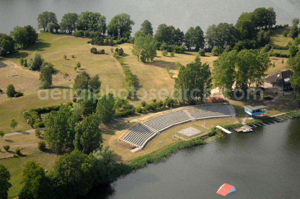 Feldberg from above - Blick auf die Wasserski-Tribüne auf der Halbinsel Amtswerder am Haussee in Feldberg - Mecklenburg-Vorpommern MV. View onto the water ski tribune of the peninsula Amtswerder at the lake Haussee in Feldberg - Mecklenburg-Western Pomerania.