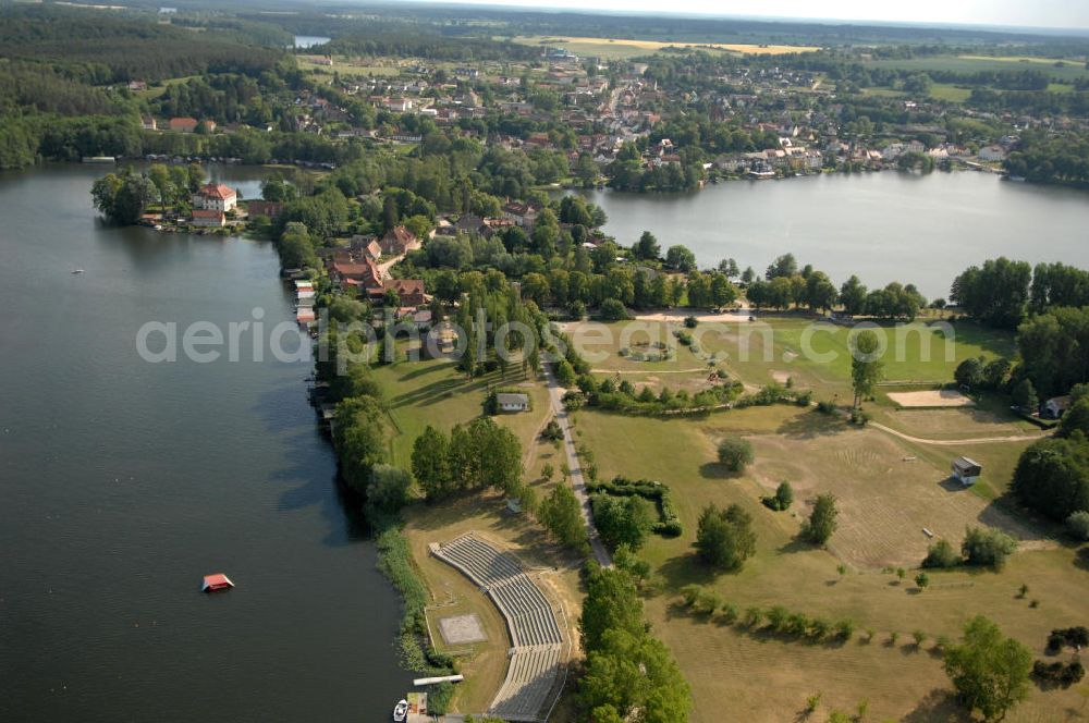 Aerial image Feldberg - Blick auf die Wasserski-Tribüne auf der Halbinsel Amtswerder am Haussee in Feldberg - Mecklenburg-Vorpommern MV. View onto the water ski tribune of the peninsula Amtswerder at the lake Haussee in Feldberg - Mecklenburg-Western Pomerania.