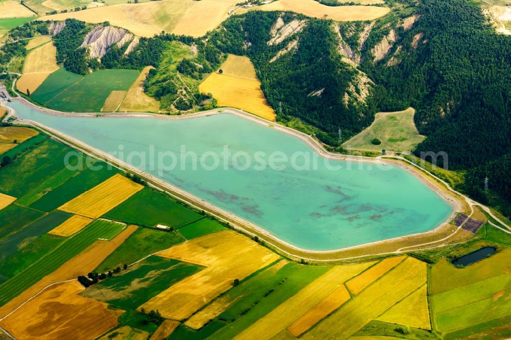 Lazer from above - Water reservoir and lake for agricultural irrigation in summer from melting water in Lazer in Provence-Alpes-Cote d'Azur, France