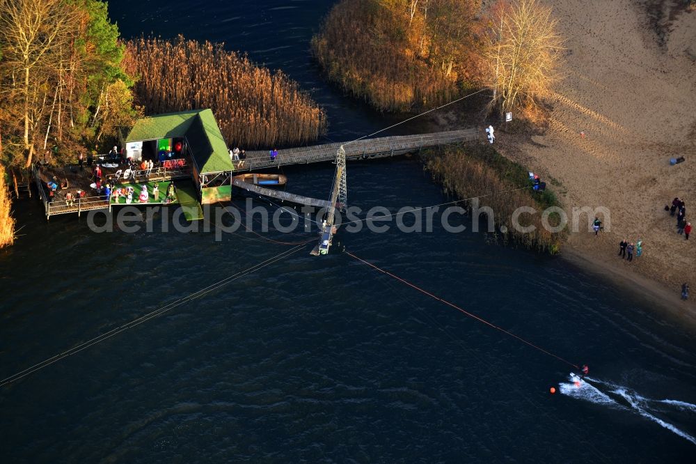 Aerial photograph Marienwerder - Water sports facilities of Wasserski Ruhlsdorf GmbH on the Kiessee. The start of a waterskiing and wakeboarding lift in Marienwerderstraße in the state of Brandenburg