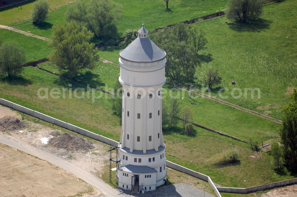 Eilenburg from the bird's eye view: Blick auf den Wasserturm in Eilenburg-Ost. Es ist das eindruckvollste technische Bauwerk der Stadt. Der Turm ist 60 Meter hoch und wurde 1916 errichtet. 2002 fand aufgrund Hochwasserschäden eine Sanierung statt. Heute dient er als Löschwasserspeicher. Kontakt: 04838 Eilenburg, Email: webmaster@eilenburg.de