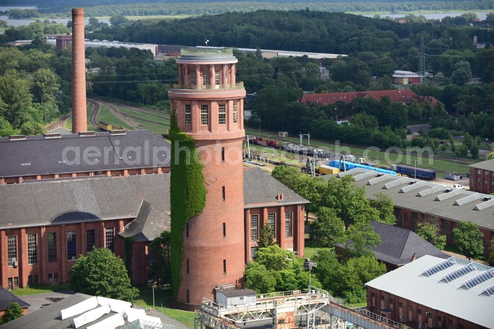 Aerial photograph Kirchmöser - View of the landmark of Kirchmoeser, the water tower. This building is a protected monument and is today used by the forestry industry as a guard and coordination point