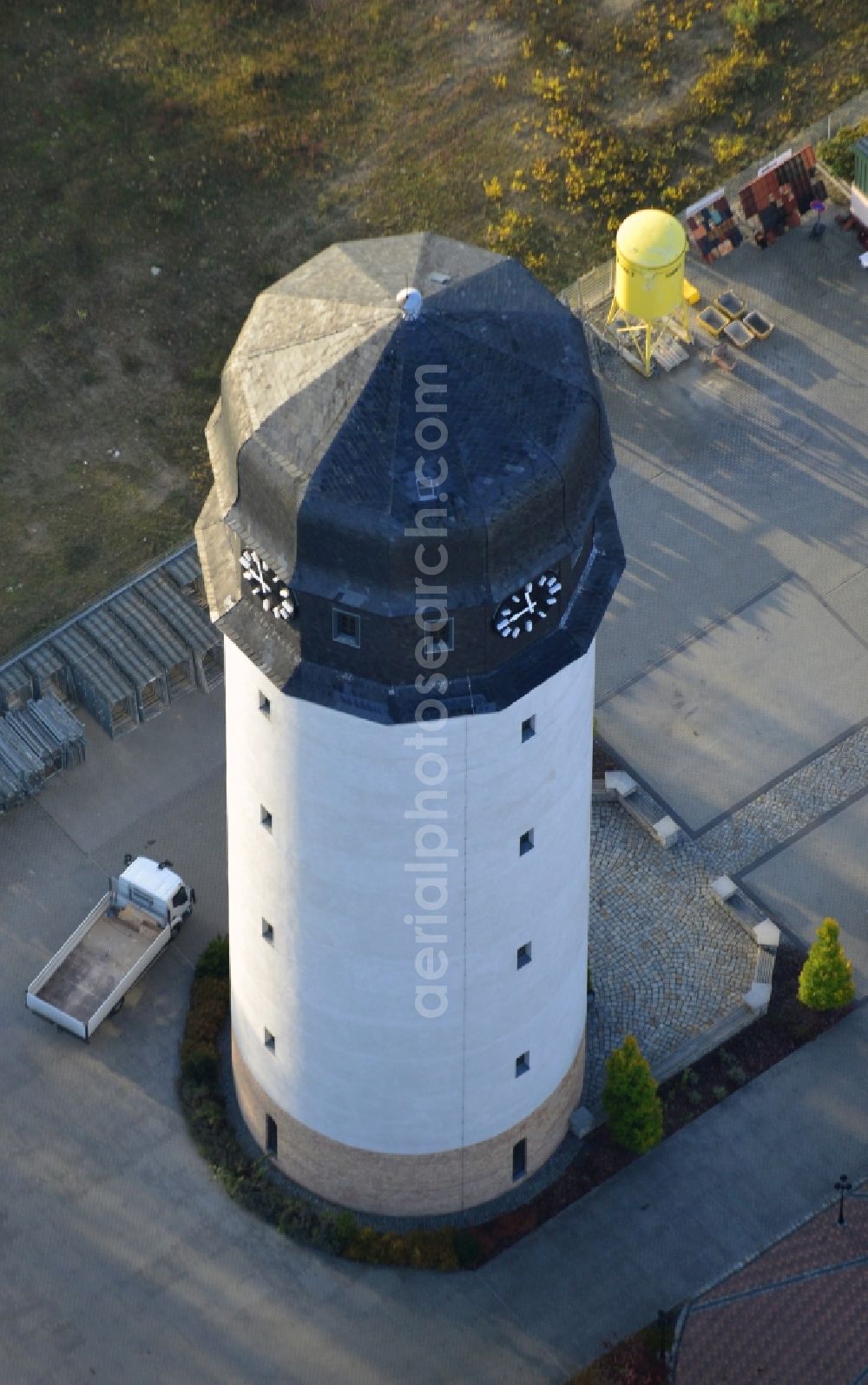 Premnitz from above - View onto the water tower of Premnitz in the state Brandenburg. The water tower was once the industrial water reservoir of the production of gunpowder and later the production of rayon staple and chemical fibre. Today the tower houses an exhibition of Premnitz' industrial history