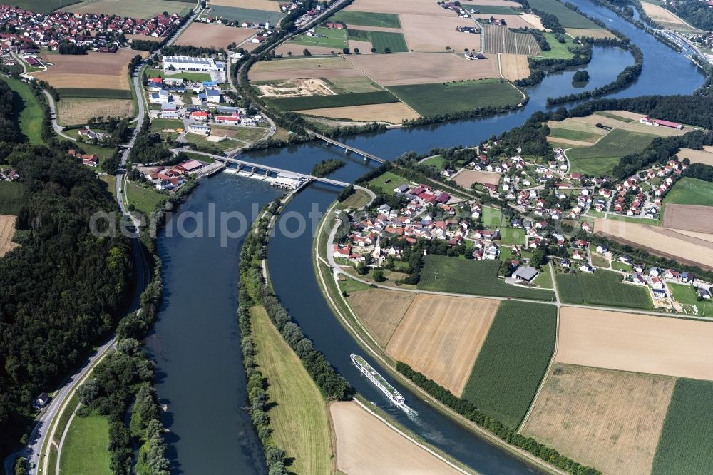 Bad Abbach from above - Structure and dams of the waterworks and hydroelectric power plant on Donau sowie ein Passagierschiff on Kanal in Bad Abbach in the state Bavaria, Germany