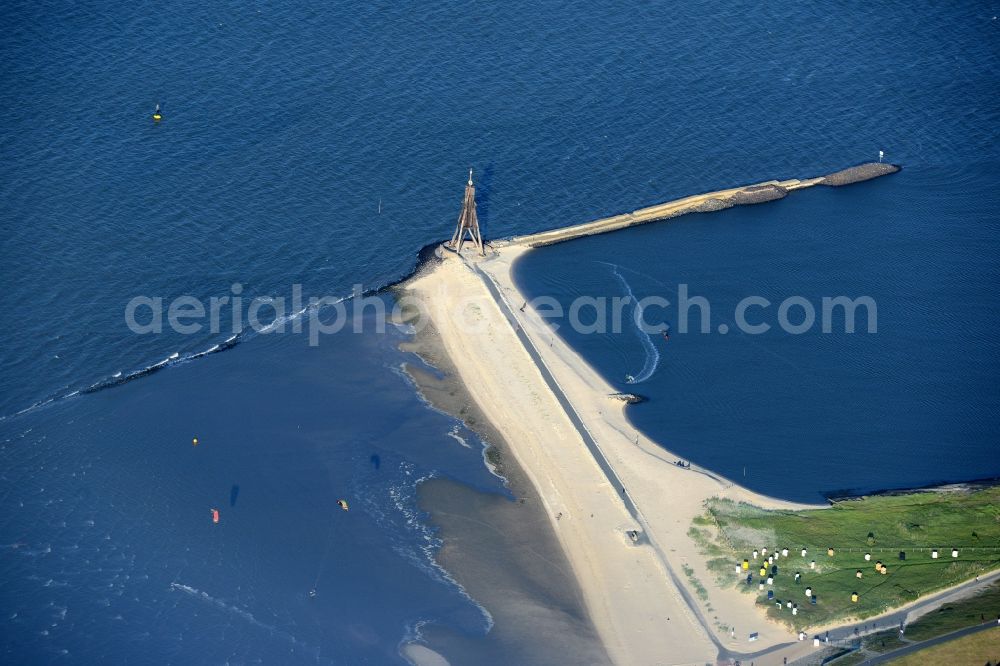 Cuxhaven from the bird's eye view: The Kugelbake in the Wadden Sea the North Sea coast in Sahlenburg in Cuxhaven in Lower Saxony. The Kugelbake is made of wood, navaids. Measured from the mean high tide to the middle of the small ball is their height 28.4 m. Down it goes on the sandy path to Doeser dike, left the water is the same