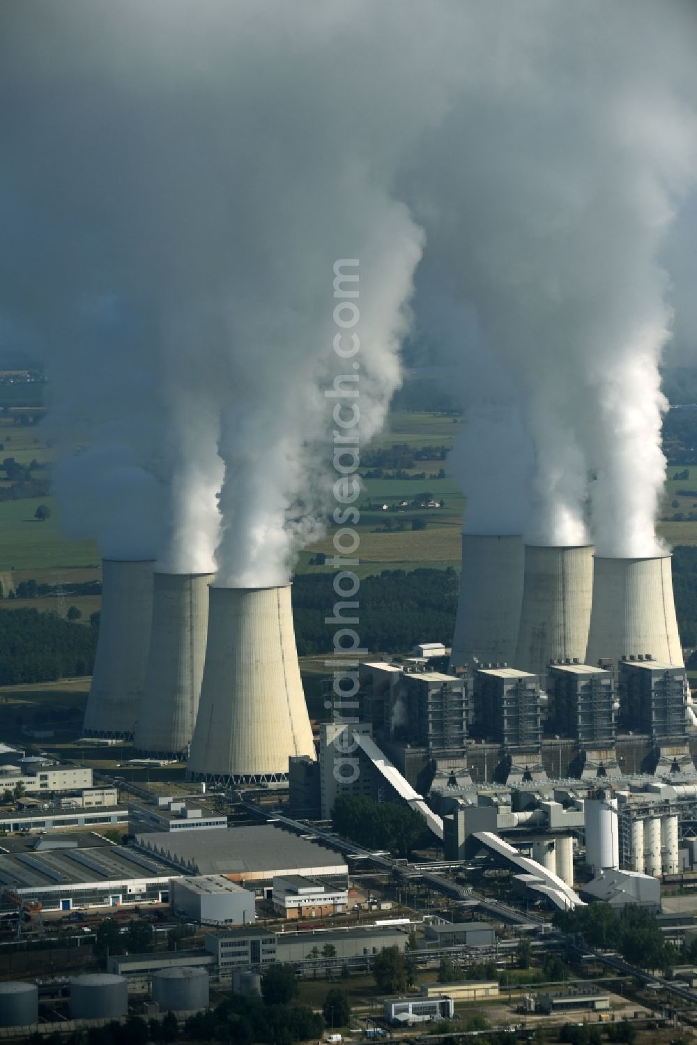 Aerial image Jänschwalde - Clouds of exhaust gas in the cooling towers of the power plant Jaenschwalde, a lignite-fired thermal power plant in southeastern Brandenburg. Power plant operator is to Vattenfall Europe belonging Vattenfall Europe Generation AG, which emerged from VEAG