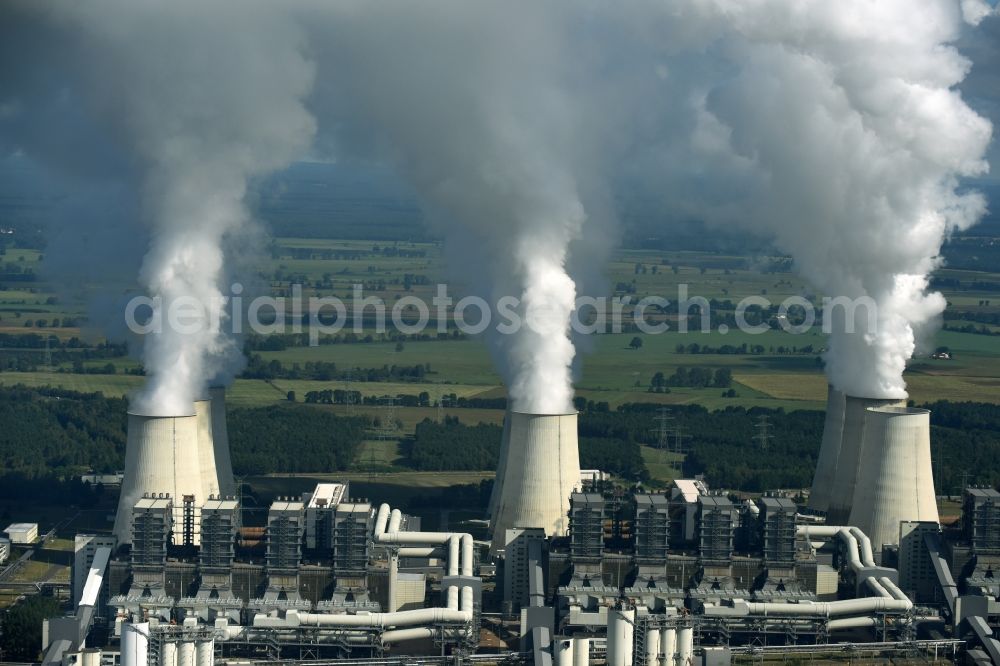 Aerial photograph Jänschwalde - Clouds of exhaust gas in the cooling towers of the power plant Jaenschwalde, a lignite-fired thermal power plant in southeastern Brandenburg. Power plant operator is to Vattenfall Europe belonging Vattenfall Europe Generation AG, which emerged from VEAG