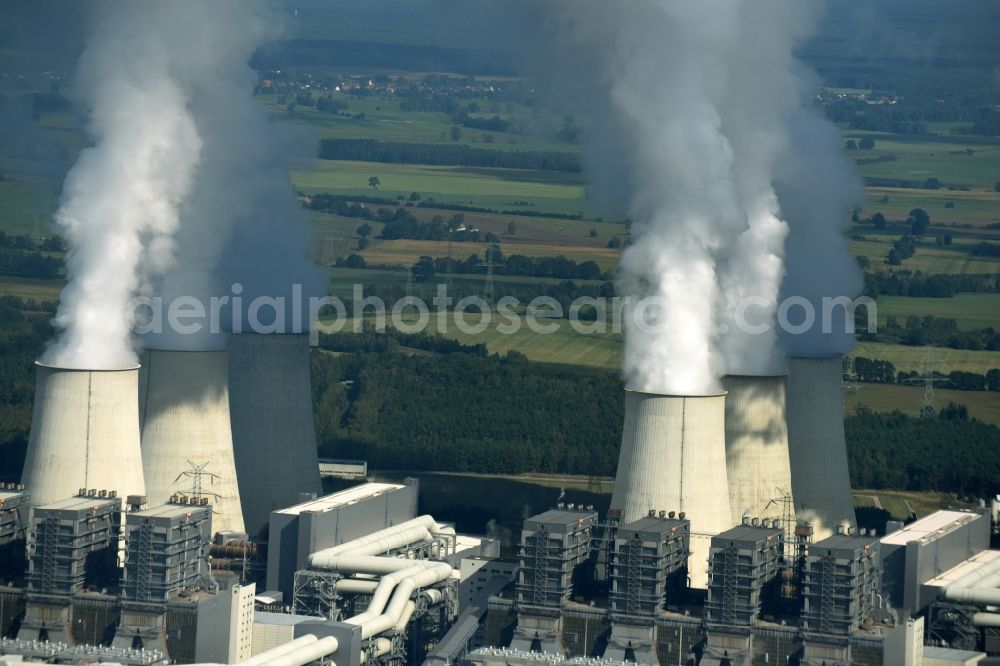 Jänschwalde from the bird's eye view: Clouds of exhaust gas in the cooling towers of the power plant Jaenschwalde, a lignite-fired thermal power plant in southeastern Brandenburg. Power plant operator is to Vattenfall Europe belonging Vattenfall Europe Generation AG, which emerged from VEAG