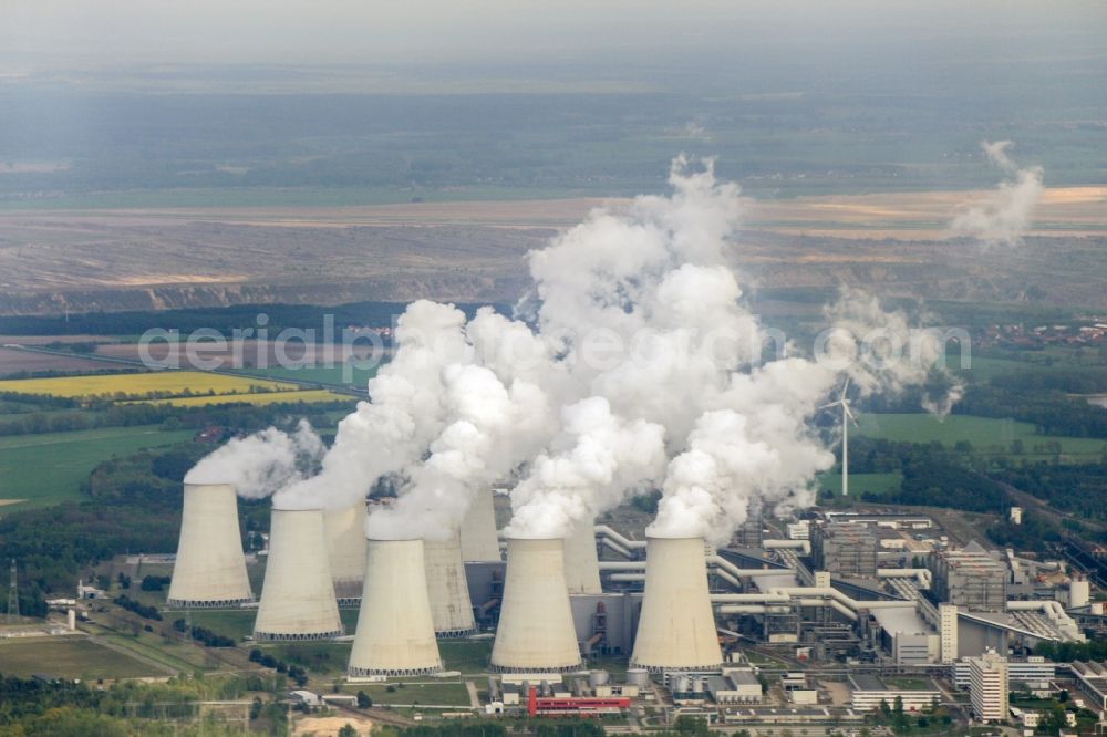 Teichland from the bird's eye view: Clouds of exhaust gas in the cooling towers of the power plant Jaenschwalde, a lignite-fired thermal power plant in southeastern Brandenburg. Power plant operator is to Vattenfall Europe belonging Vattenfall Europe Generation AG, which emerged from VEAG