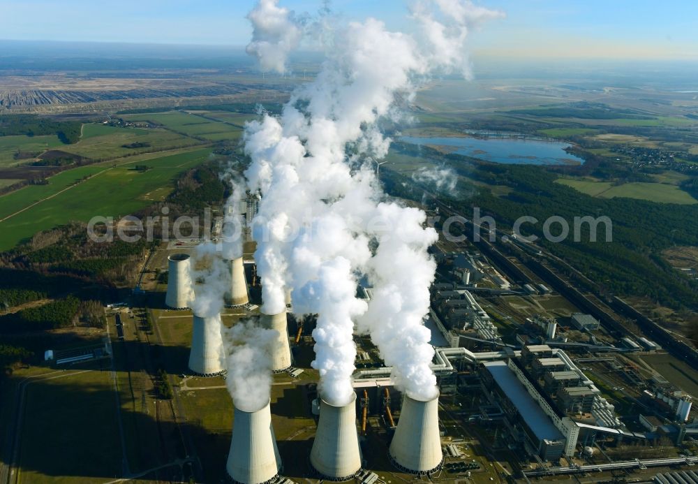 Teichland from the bird's eye view: Clouds of exhaust gas in the cooling towers of the power plant Jaenschwalde, a lignite-fired thermal power plant in southeastern Brandenburg. Power plant operator is to Vattenfall Europe belonging Vattenfall Europe Generation AG, which emerged from VEAG