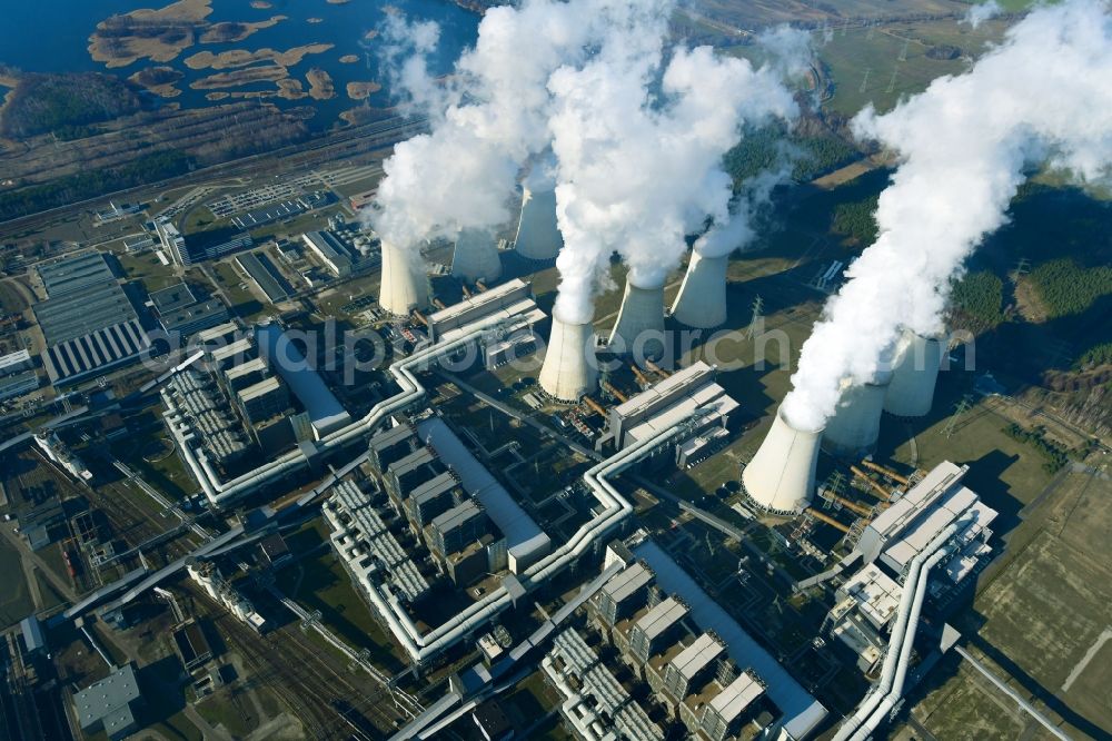 Teichland from the bird's eye view: Clouds of exhaust gas in the cooling towers of the power plant Jaenschwalde, a lignite-fired thermal power plant in southeastern Brandenburg. Power plant operator is to Vattenfall Europe belonging Vattenfall Europe Generation AG, which emerged from VEAG