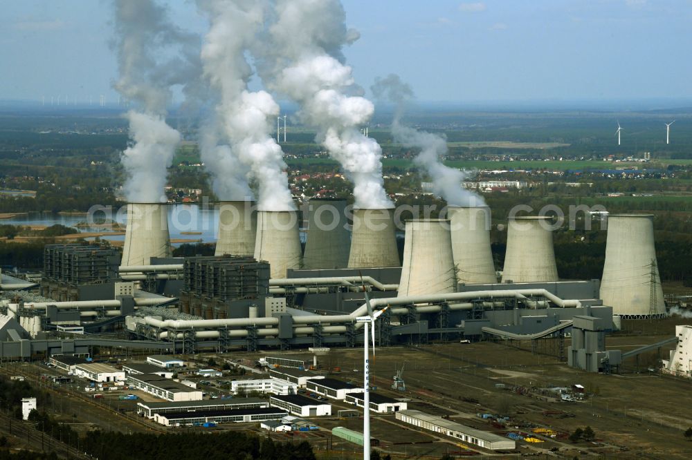 Teichland from the bird's eye view: Clouds of exhaust gas in the cooling towers of the power plant Jaenschwalde, a lignite-fired thermal power plant in southeastern Brandenburg. Power plant operator is to Vattenfall Europe belonging Vattenfall Europe Generation AG, which emerged from VEAG