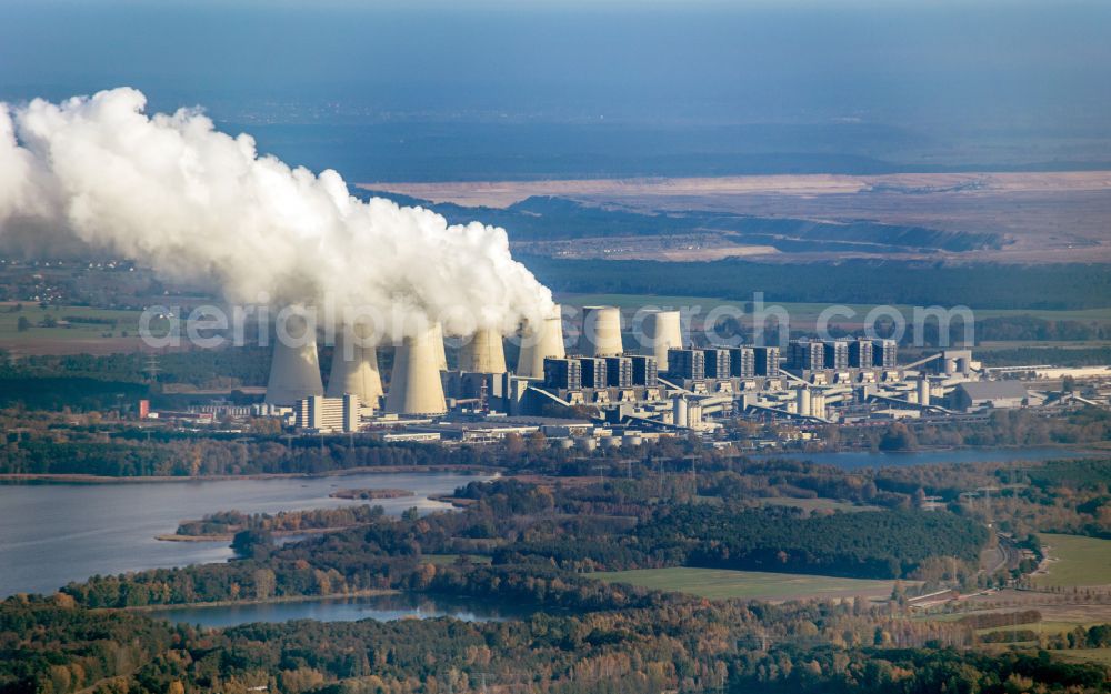 Teichland from the bird's eye view: Clouds of exhaust gas in the cooling towers of the power plant Jaenschwalde, a lignite-fired thermal power plant in southeastern Brandenburg. Power plant operator is to Vattenfall Europe belonging Vattenfall Europe Generation AG, which emerged from VEAG