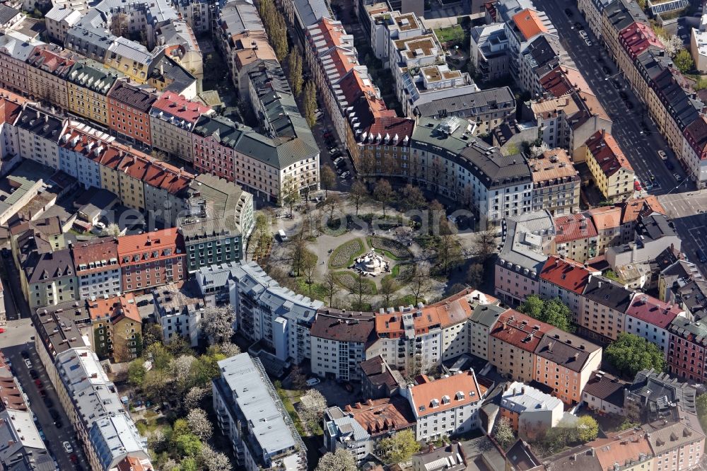 München from above - Weissenburger place in Munich Haidhausen in the state Bavaria. Flowerbeds are created concentrically to the Glaspalast fountain in the middle of the square. For Weissenburger Platz lead Metzstrasse, Weissenburger Strasse and Lothringerstrasse