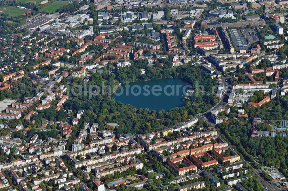 Aerial image Berlin - The White Lake is a lake in the district of Weissensee in the Berlin district of Pankow. Around the lake there is the Weissensee Park. On its banks there is a boat rental station and the historic Milchhaeuschen. At the eastern end of the lake, beach days Weissensee, located on the street of the village church Weissensee Berliner Allee, the oldest building in the old village of the district Weissensee