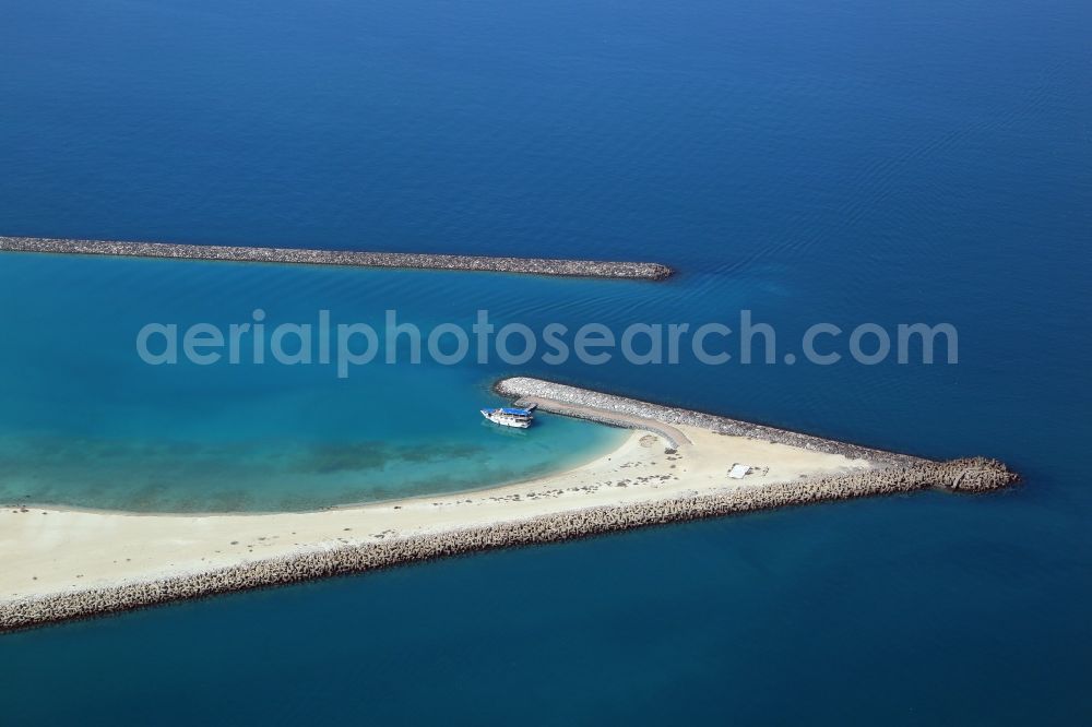 Abu Dhabi from above - Breakwater in front of the artificial Al Lulu Island in Abu Dhabi in United Arab Emirates