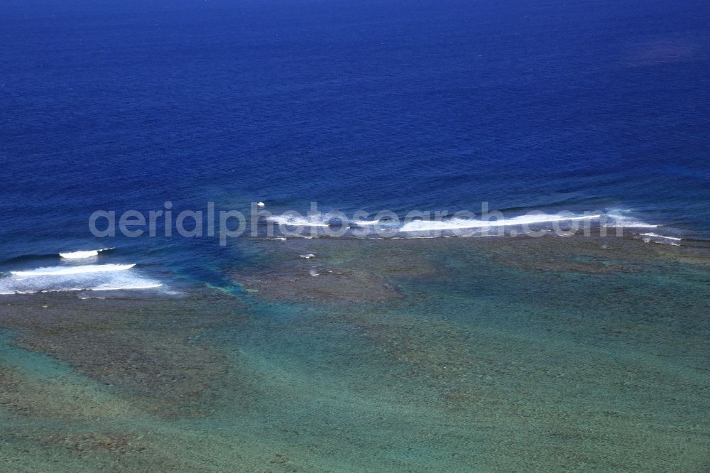 Baie du Cap from the bird's eye view: Coral reef as wave-breaker and lagoon at the coast in Baie du Cap on the island Mauritius in the Indian Ocean