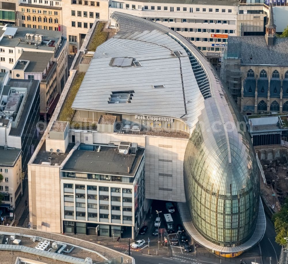 Aerial image Köln - Weltstadthaus (Metropolitan House) of the Peek & Cloppenburg company in Koeln in the state of North Rhine-Westphalia. The shopping building on Schilder Street was designed by the architect Renzo Piano and has a ship-like shape with glas facade. The mall is run by the fashion company and chain Peek&Cloppenburg