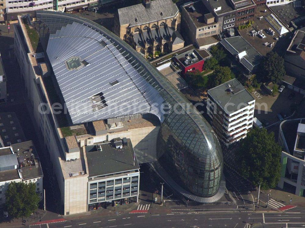 Aerial image Köln (NRW) - Blick auf das neue von der Peek & Cloppenburg KG Düsseldorf erbaute Weltstadthaus in der Kölner Innenstadt. Der Glaspalast mit seinem ovalen Grundriss und seiner schalenförmigen Fassade wurde von dem Architekten Renzo Piano erschaffen. Ab September wird auf rund 14.200 Quadratmetern Verkaufsfläche und fünf Etagen Damen-, Herren- und Kindermode vertrieben. Peek & Cloppenburg KG, Weltstadthaus, Köln - Schildergasse, 50667 Köln, Schildergasse 65-67, 0221 - 453900