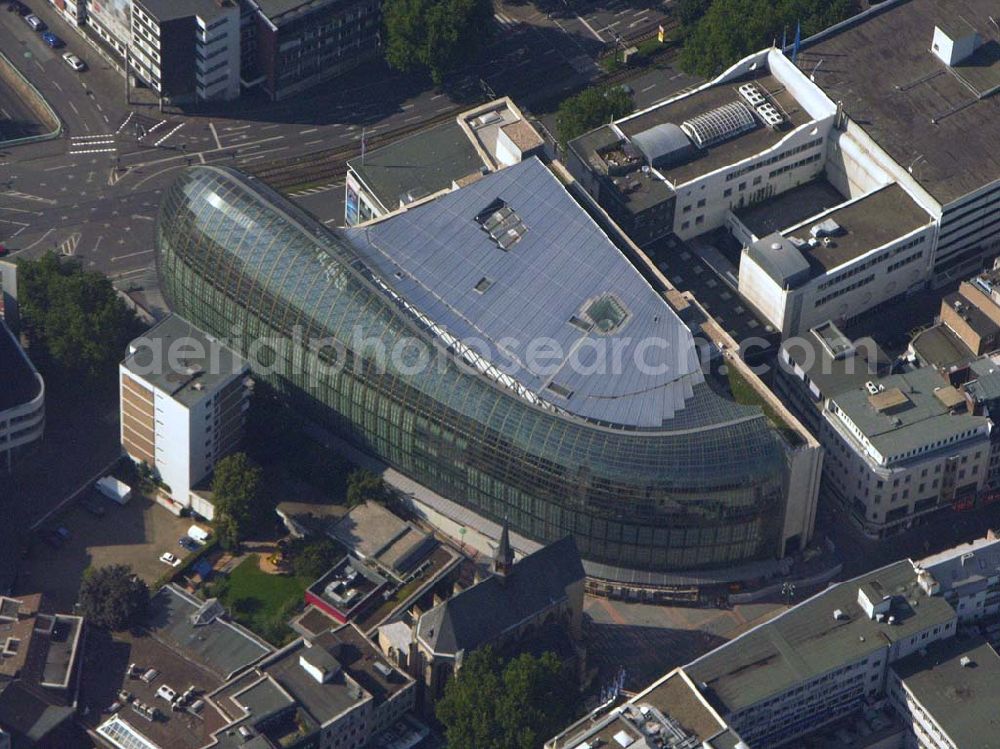 Köln (NRW) from the bird's eye view: Blick auf das neue von der Peek & Cloppenburg KG Düsseldorf erbaute Weltstadthaus in der Kölner Innenstadt. Der Glaspalast mit seinem ovalen Grundriss und seiner schalenförmigen Fassade wurde von dem Architekten Renzo Piano erschaffen. Ab September wird auf rund 14.200 Quadratmetern Verkaufsfläche und fünf Etagen Damen-, Herren- und Kindermode vertrieben. Peek & Cloppenburg KG, Weltstadthaus, Köln - Schildergasse, 50667 Köln, Schildergasse 65-67, 0221 - 453900