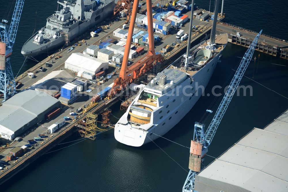 Aerial photograph Kiel - Shipyard - site of the ThyssenKrupp Marine Systems GmbH in Kiel in the state Schleswig-Holstein. In Dock Kiel superyacht shipyard Nobiskrug German Naval Yards is the luxury - yacht 787 new building with the project name White Pearl