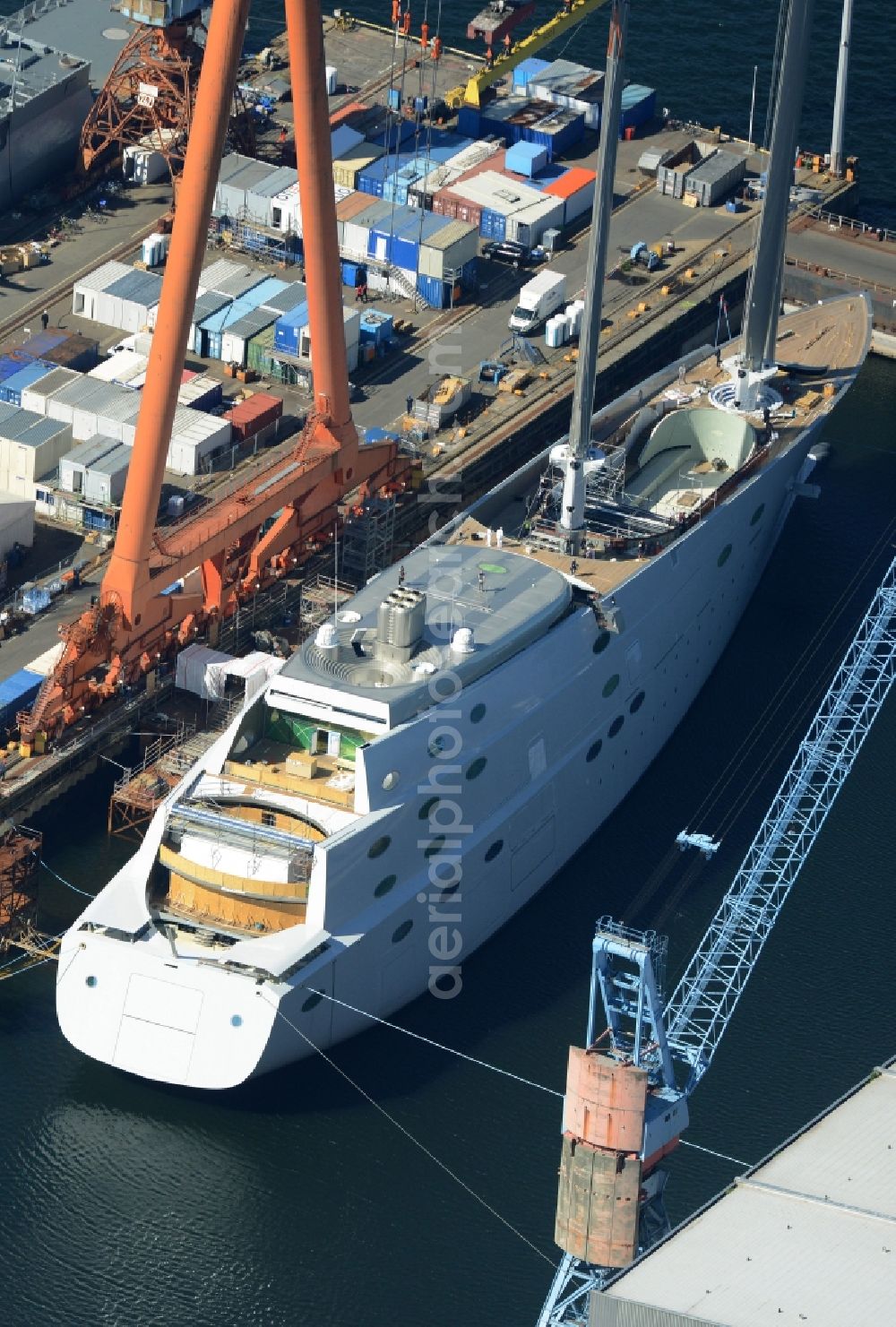 Kiel from the bird's eye view: Shipyard - site of the ThyssenKrupp Marine Systems GmbH in Kiel in the state Schleswig-Holstein. In Dock Kiel superyacht shipyard Nobiskrug German Naval Yards is the luxury - yacht 787 new building with the project name White Pearl