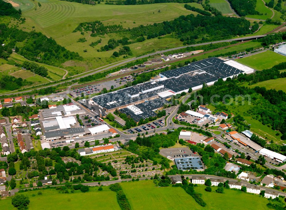 Rockenhausen from the bird's eye view: Building and production halls on the premises of Adient Components Ltd. & Co. KG on street Industriestrasse in Rockenhausen in the state Rhineland-Palatinate, Germany