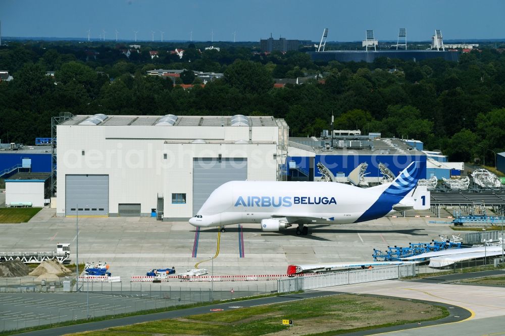 Bremen from the bird's eye view: Building and production halls on the premises of Airbus along the Airbus-Allee in the district Neustadt in Bremen, Germany. In the foreground a transport plane of the Tyues Beluga with the identification F-GSTA - factory number 1