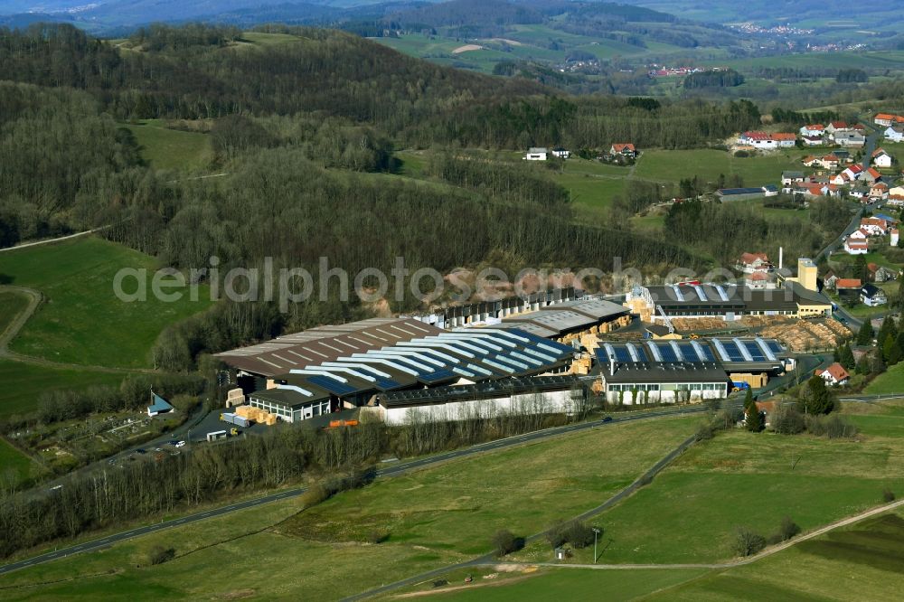 Aerial image Poppenhausen (Wasserkuppe) - Building and production halls on the premises of Aloysius Krenzer GmbH & Co. KG on Wasserkuppenstrasse in the district Abtsroda in Poppenhausen (Wasserkuppe) in the state Hesse, Germany