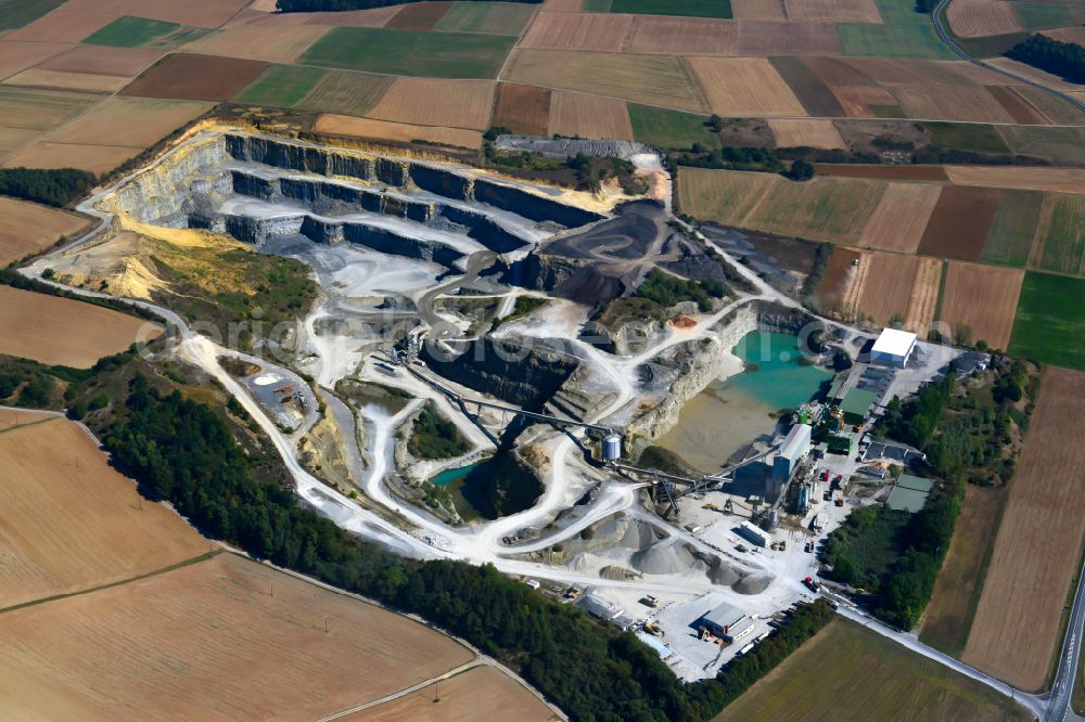 Aerial photograph Waldbüttelbrunn - Building and production halls on the premises AMW | Asphaltmischwerk Rossbrunn in Waldbuettelbrunn in the state Bavaria, Germany