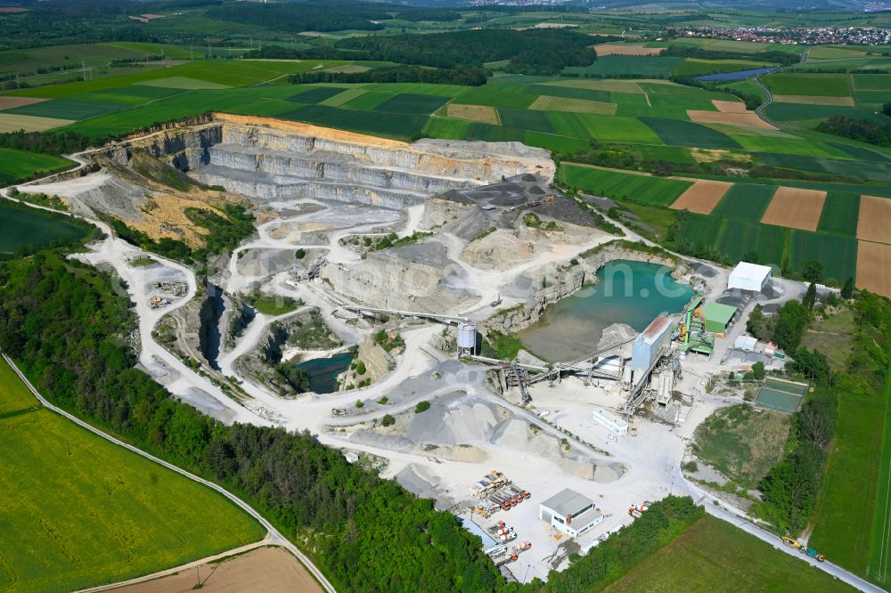 Waldbüttelbrunn from the bird's eye view: Building and production halls on the premises AMW | Asphaltmischwerk Rossbrunn in Waldbuettelbrunn in the state Bavaria, Germany