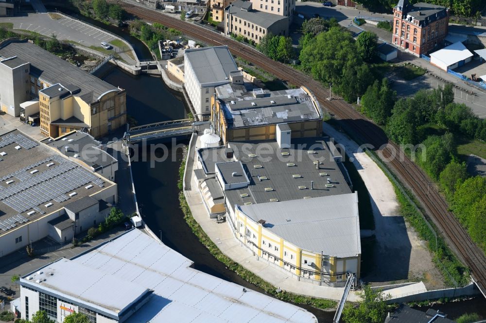 Aue from the bird's eye view: Buildings and production halls on the premises of the bedding manufacturer of Curt Bauer GmbH in Aue in the federal state of Saxony, Germany