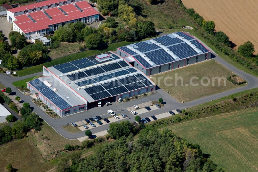 Grünsfeld from above - Building and production halls on the premises of Bohlenof GmbH on Waltersberg in Gruensfeld in the state Baden-Wurttemberg, Germany