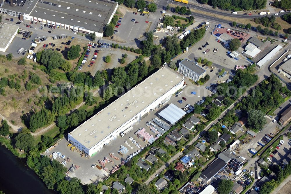 Berlin from above - Building and production halls on the premises of Baethge Baustoffe GmbH & Co. KG Am Juliusturm in the district Spandau in Berlin, Germany