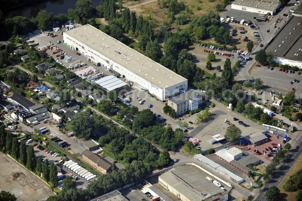 Berlin from above - Building and production halls on the premises of Baethge Baustoffe GmbH & Co. KG Am Juliusturm in the district Spandau in Berlin, Germany