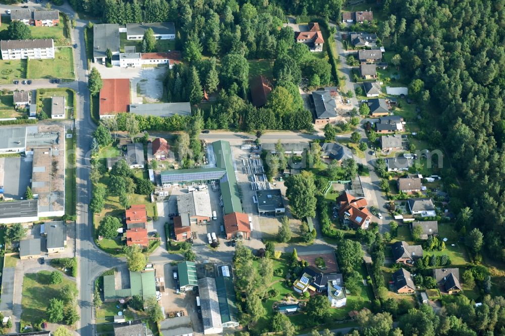 Munster from the bird's eye view: Building and production halls on the premises of Busse Alu-Bau GmbH An der Raubkammer in Munster in the state Lower Saxony