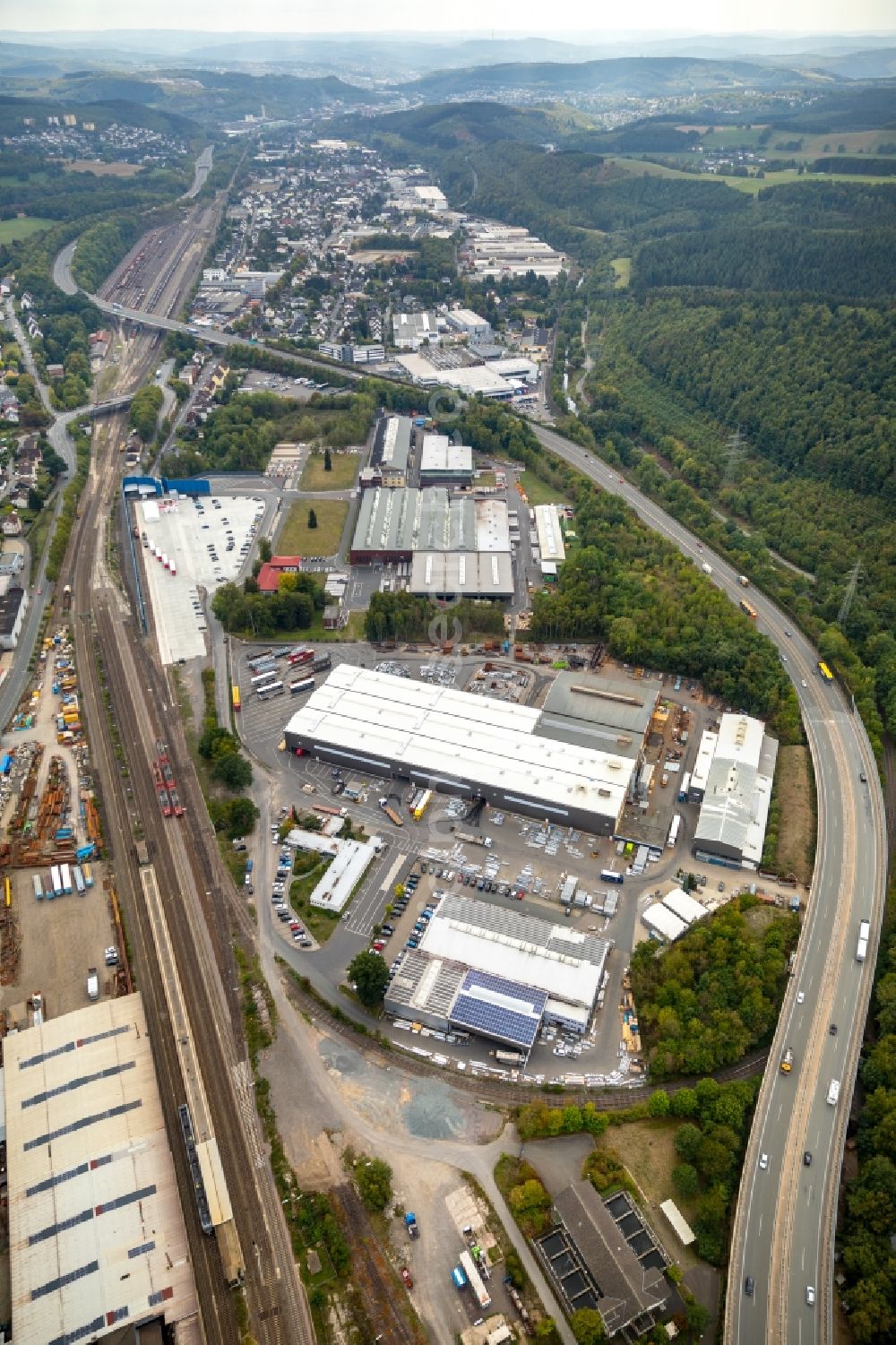 Kreuztal from the bird's eye view: Building and production halls on the premises of COATINC SIEGEN GMBH on Huettenstrasse in Kreuztal in the state North Rhine-Westphalia, Germany